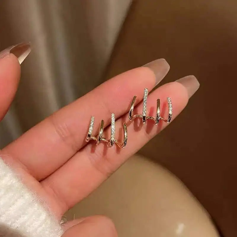 CLAW® ARETES DE LUJO ESTILO GARRA